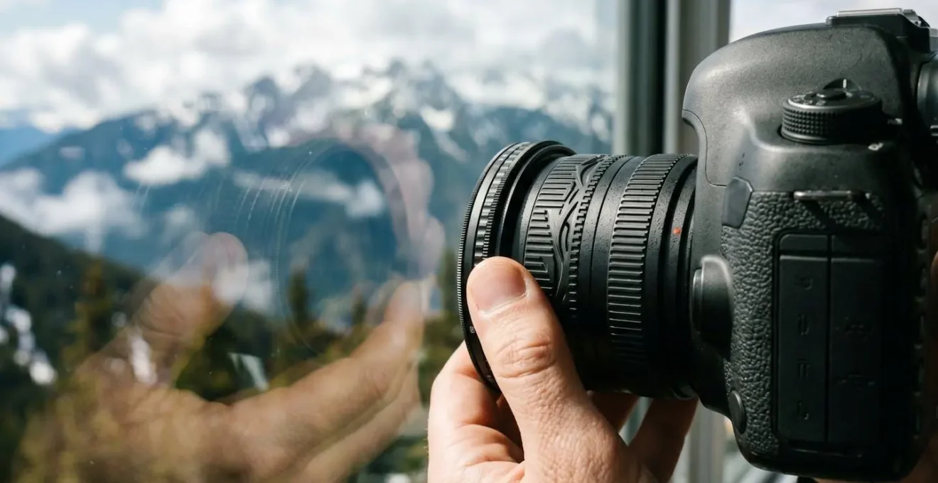 Close-up of camera lens with circular polarizing filter adjusting reflections on observation window