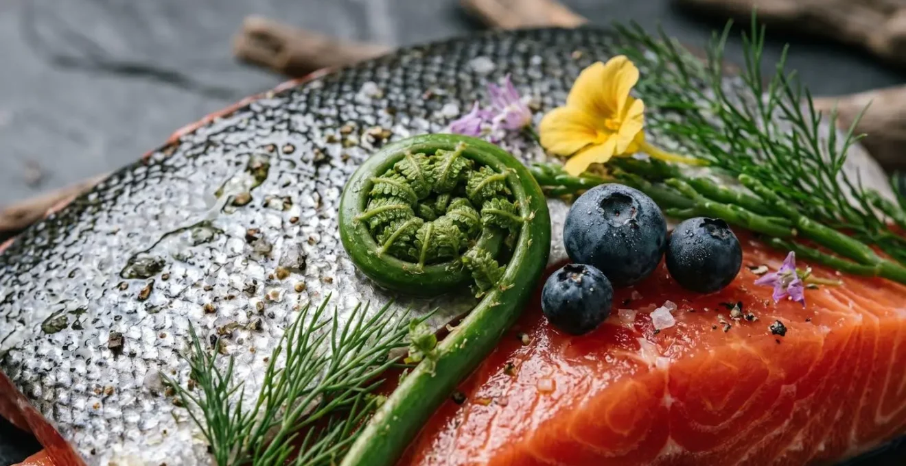Fresh Pacific salmon with locally foraged ingredients representing West Coast culinary philosophy