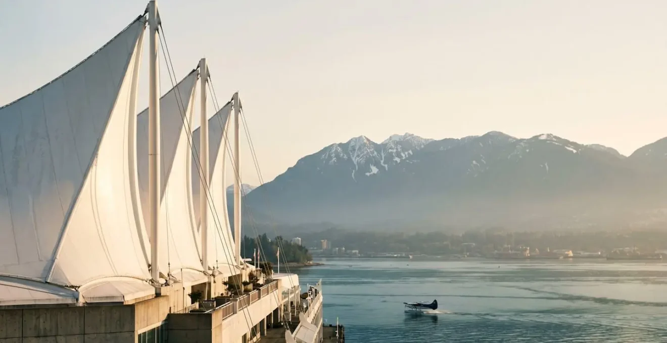 Architectural detail of Canada Place white sail structures against mountain backdrop from elevated viewpoint