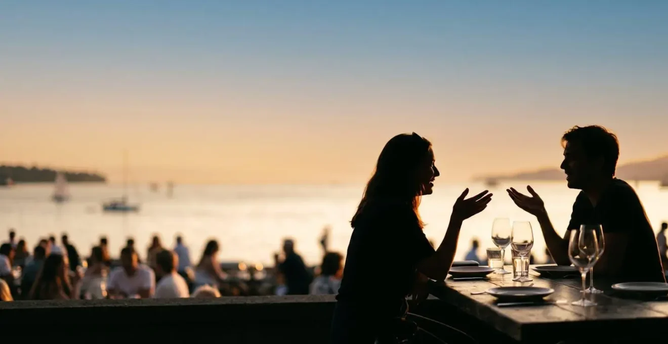 Silhouetted diners on waterfront patio overlooking English Bay during golden hour with warm ambient lighting and Pacific Ocean view